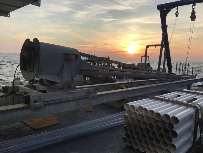 Figure 1: With the sun rising over the horizon, the coring rig sits ready for deployment. Image courtesy of A. Herre-ra- Schneider.