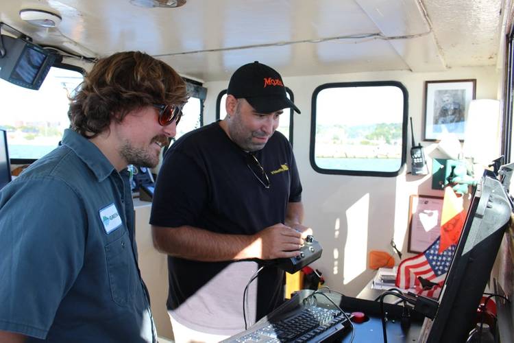 Andy Goldstein, VP Engineering, VideoRay, and Colin Riggs, Sr. Engineer, Greensea, review the final software integration for the Mission Specialist ROV. (Photo: Greensea)