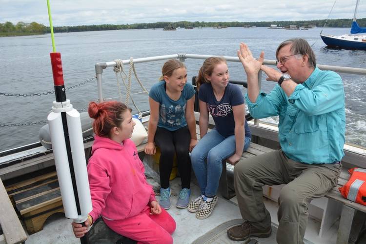 Graham explains to Islesboro, ME students how the Sea Rocket works. © Isleboro Central School