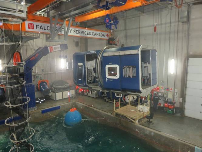 The ‘helicopter cabin’ (blue box structure) positioned above the pool. The ‘offshore worker’ is inside the cabin. (Photo: Tom Mulligan)