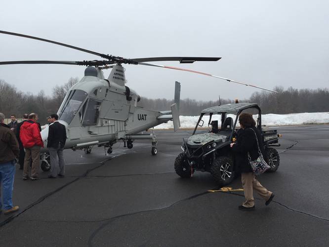 The K-MAX helicopter, seen here with the unmanned UxInterceptor vehicle, can be operated in the manned or unmanned mode, and can lift 6,000 lbs.