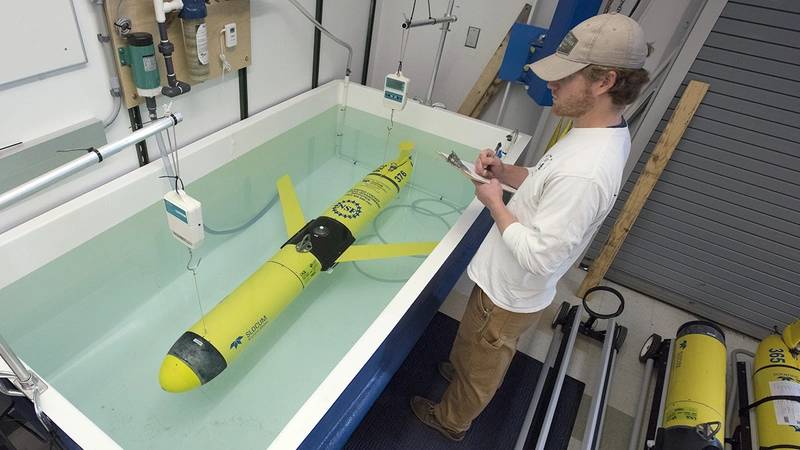 The OOI is not just made up of instrument systems anchored to the sea floor. Ocean gliders such as this one move between and beyond the moorings for months at a time, measuring temperature, salinity, and other critical ocean properties that help scientists understand what is happening far beyond the anchored moorings. The vehicles have no motor: they literally glide through the water by changing their buoyancy.  (Photo by Tom Kleindinst, Woods Hole Oceanographic Institution)