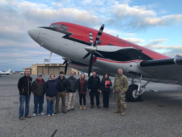  The JALBTCX team standing with COL. Thomas Asbery, Former District Commander, New York District, U.S. Army Corps of Engineers (far right), in front of their aircraft, at Long Island MacArthur Airport in Ronkonkoma, New York.  Credit:  USACE.