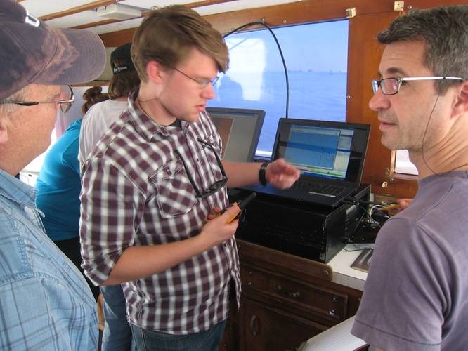 Karl Krussel and Jose Luis Casaban discuss the use of Hypack in the field with J.B. Pelletier aboard TAMUG's R/V Earl Milan. (Photo courtesy of HYPACK)