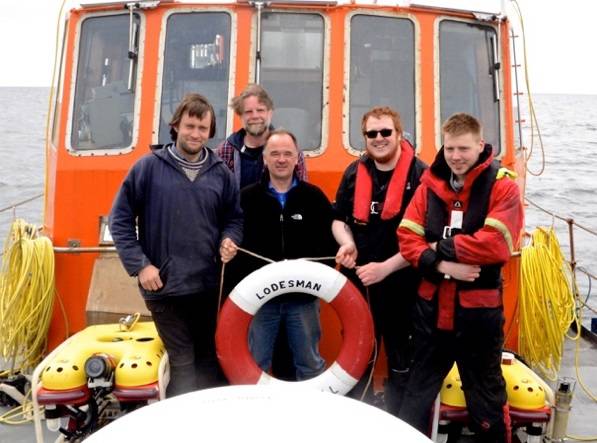 Keith Bichan (center) and some members of the survey team. (Courtesy Keith Bichan, Roving Eye Enterprises.)