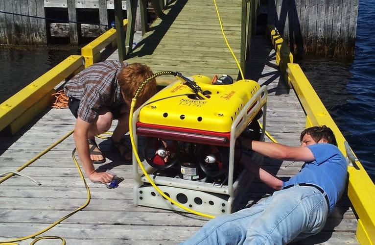 Laboratory Director Dr. Ralf Bachmayer (right) and PhD student Brain Claus preparing the Falcon for an AUV retrieval mission – one of its roles at AOSL.