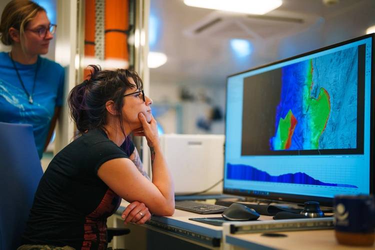 Lauren Seyler (Co-Principal Investigator, Stockton University) reviews mapping data while searching for methane seeps. Scientists on a research expedition on Schmidt Ocean Institute’s Research Vessel Falkor (too) have located Chile’s deepest and most northern methane seeps. At 2836 meters deep, the methane seeps provide chemical energy for deep-sea animals living without sunlight, offering potential insights into the conditions that led to the development of life on Earth.
Credit: Alex Ingle / S