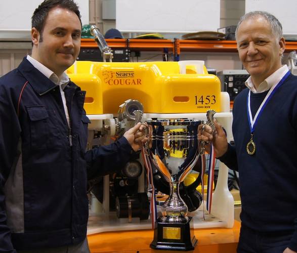 Mark Exeter, Operations Director, presents 5S Champions League cup to DavidPycroft, Team Leader, Small Assembly.