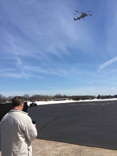 Dave Martin of Neya Systems uses an Android tablet to control both an unmanned aircraft and ground vehicle at the same time.