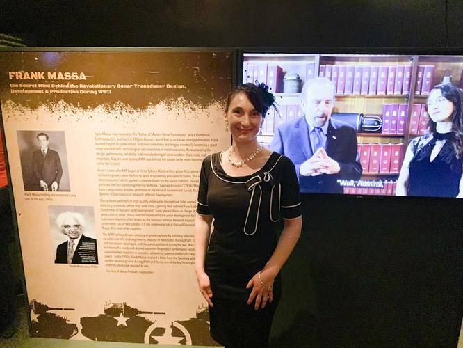 Dawn Massa Stancavish standing in front of a display at the Reagan National Library’s “Secrets of WWII” exhibit honoring her grandfather, Frank Massa. Photo courtesy Massa
