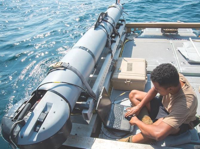 Mineman 3rd Class John Stephen-Torres, Commander, Task Group (CTG) 56.1, observes data from a MK 18 MOD 2 UUV for a training evolution during a mine countermeasures squadron exercise (SQUADEX) aboard the Bay-class landing dock ship Cardigan Bay (L3009) of the Royal Fleet Auxiliary. CTG 56.1 conducts mine countermeasures, explosive ordnance disposal, salvage-diving, and force protection operations throughout the U.S. 5th Fleet area of operations. (U.S. Navy photo by Jonah Stepanik)