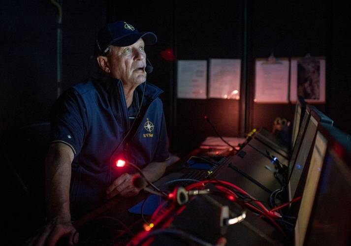 In 2019, Nautilus plied the Pacific waters off the island of Nikumaroro, searching for any sign of Amelia Earhart's lost plane. In the cool, dark control room, we kept a 24-hour vigil. (Gabriel Scarlett/National Geographic Image Collection)