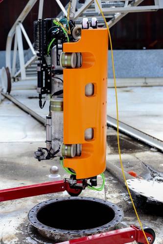 The Nortek DVL1000 leads the way as the inspection vehicle enters a tank. The DVL operates to a high degree of accuracy in the harsh environment inside. Image courtesy Nortek/Square Robot