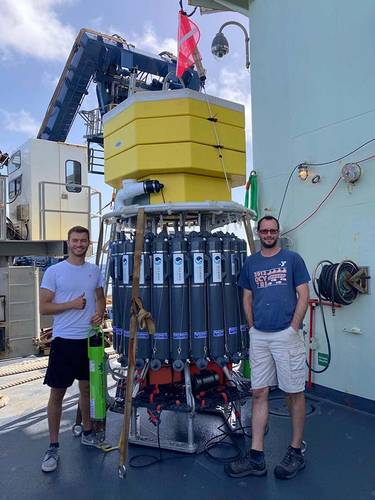 Phil Parisi (left) and URI Professor Christopher Roman stand beside the deep autonomous profiler. Photo courtesy of
Roman Lab / URI.
