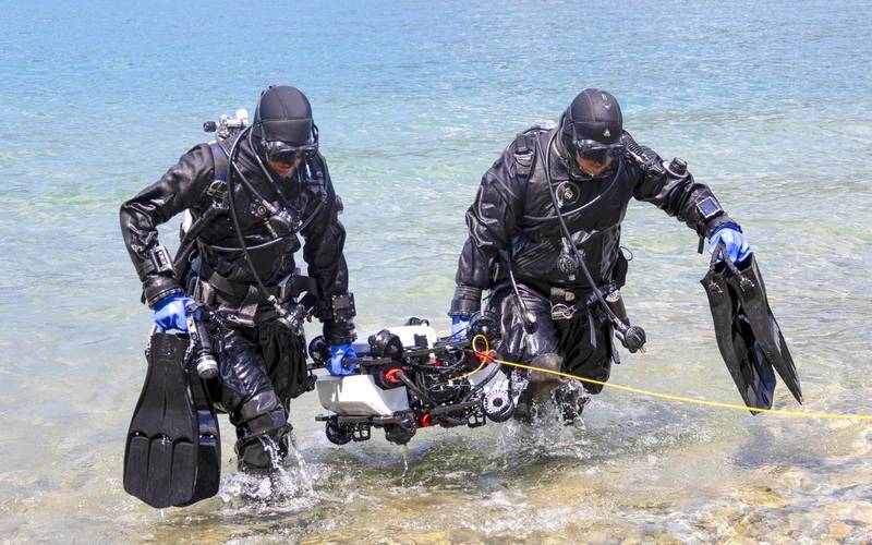 Professional divers and the Tethys ROV after an underwater inspection operation. Image courtesy Nortek