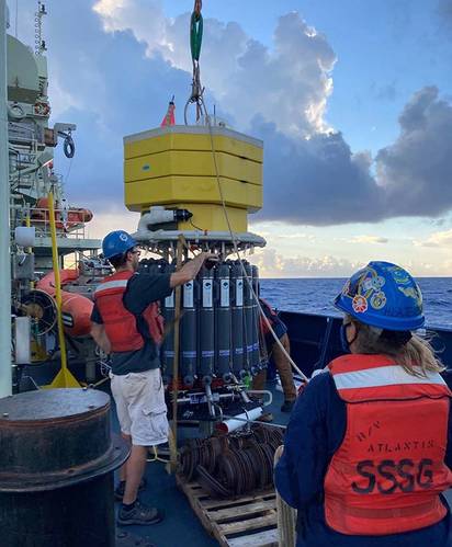 Professor Christopher Roman works on the deep autonomous profiler as Allison Heater of the Woods Hole Oceanographic
Institution looks on. Photo courtesy of Roman Lab / URI.