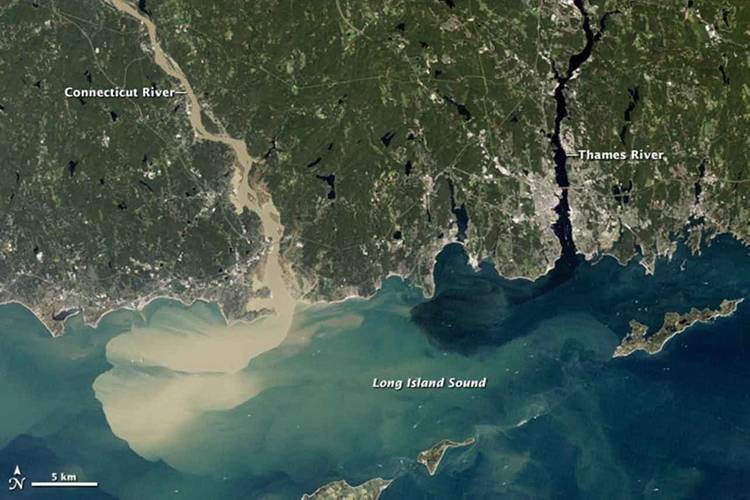 Full of rainwater from Hurricane Irene, which drenched New England in August 2011, the Connecticut River sent large amounts of muddy sediment into Long Island Sound. (Photo: NASA Earth Observatory)