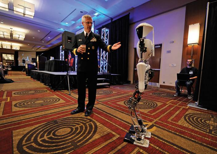 Rear Adm. Matthew L. Klunder, Chief of Naval Research, introduces CHARLI-2 from Virginia Tech’s Robotics & Mechanisms Laboratory during the Office of Naval Research (ONR) 2012 Science and Technology Partnership Conference. U.S. Navy photo by John F. Williams