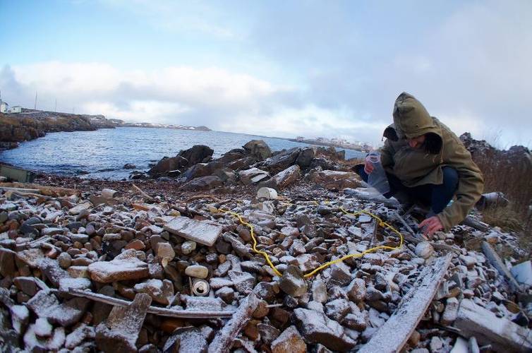 A researcher gathers marine plastic pollution from a rocky shoreline in Fogo Island, Newfoundland. The MEOPAR network and Irving Shipbuilding announced $1.8 million in funding to support nine ocean research initiatives, including four projects examining various environmental and industry challenges facing the oceans on Canada’s East Coast. (Photo: Irving Shipbuilding)