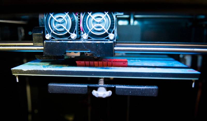 The researchers used 3D printers on board the ship to create new versions of the grippers (orange) overnight in response to feedback from the ROV pilots and biologists. (Credit: Wyss Institute at Harvard University)