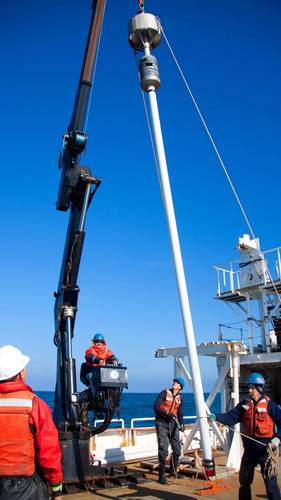 A crew retrieves a sediment core drilled from the seafloor. A new study provides the first comprehensive analysis of ocean-based sediment records to demonstrate that the Atlantic Ocean's overturning circulation began to weaken near the end of the Little Ice Age, a centuries-long cold period that lasted until about 1850. (Photo by Ian Hall, Cardiff University)