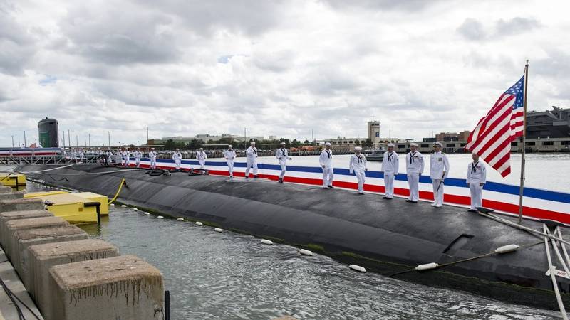 Sailors run, bringing the ship to life, during the commissioning ceremony for the Virginia-class attack submarine USS Washington (SSN 787) at Naval Station Norfolk. (U.S. Navy photo by Patrick T. Bauer)