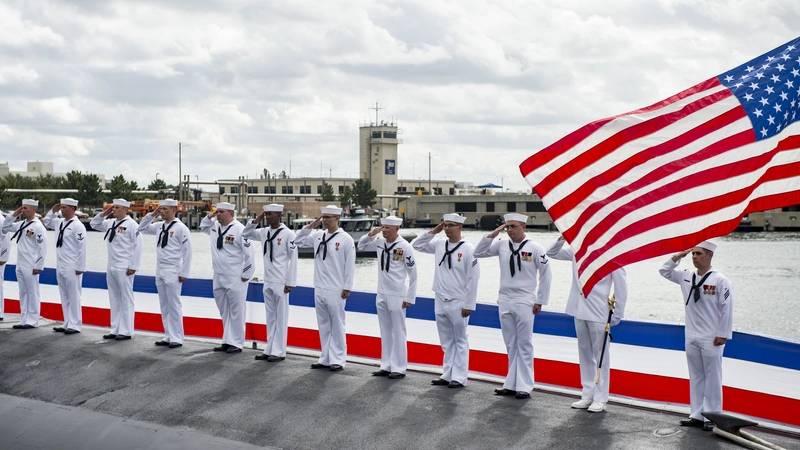 Sailors bow their heads in prayer during the commissioning ceremony for the Virginia-class attack submarine USS Washington (SSN 787) at Naval Station Norfolk. (U.S. Navy photo by Patrick T. Bauer)
