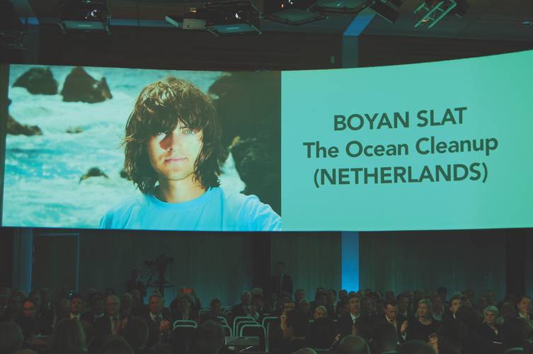 Big screen banner: Ocean Clean-Up CEO Boyan Slat above a captivated Nor-Shipping 2015 audience.