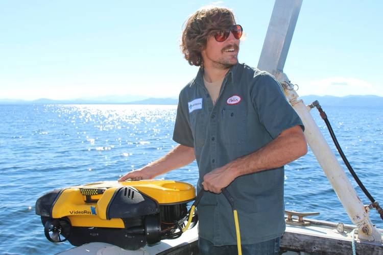 Senior engineer and product development lead, Colin Riggs, launches the Mission Specialist one-man portable ROV in Vermont. (Photo: Greensea)