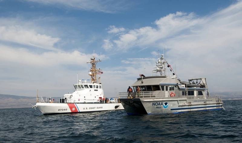 NOAA R/V Shearwater (right) and USCG Cutter Halibut (left) conduct remotely operated vehicle (ROV) operations over the USCG Cutter McCulloch shipwreck site. (Credit: Robert V. Schwemmer NOAA)