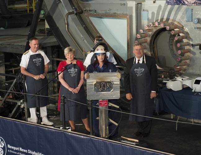 Ship's sponsor Diane Donald shows her initials during a keel laying ceremony for the future Virginia-class attack submarine Indiana (SSN 789). (U.S. Navy photo courtesy of Huntington Ingalls Industries by Ricky Thompson)