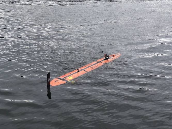 The mini AUV shown as it would be launched from the Solus LR underwater.