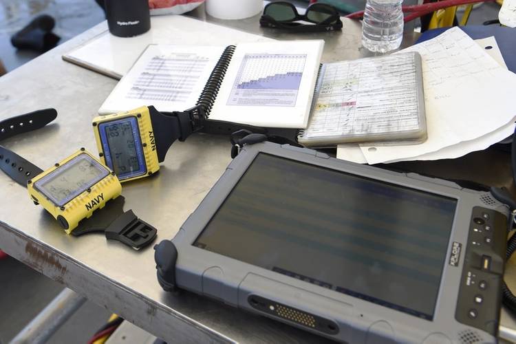 The ONR TechSolutions-sponsored scuba binary dive application (SBDA 100) replaces traditional paper logs and automates the logging and submission of dive profiles directly from a dive computer worn by Navy Divers to the Naval Safety Center DJRS database. (U.S. Navy photo by Bobby Cummings)
