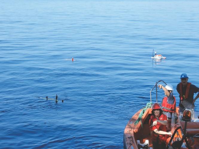 Two AUVs and one USV in their parking positions ready to start a mission. (Photo courtesy: Javier Gilabert)