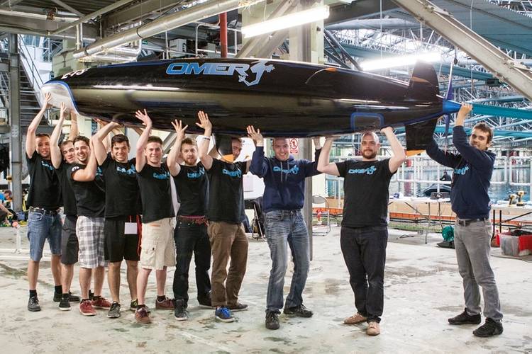 The Omer 9 team with their submarine on dry land