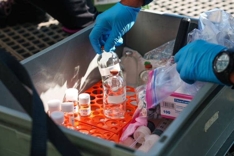 Water samples are processed as they are sampled from Niskin bottles mounted on the CTD rosette. "CTD" stands for conductivity, temperature, and depth, and refers to a package of electronic devices used to detect how the conductivity and temperature of water changes relative to depth.
Credit: Alex Ingle / Schmidt Ocean Institute