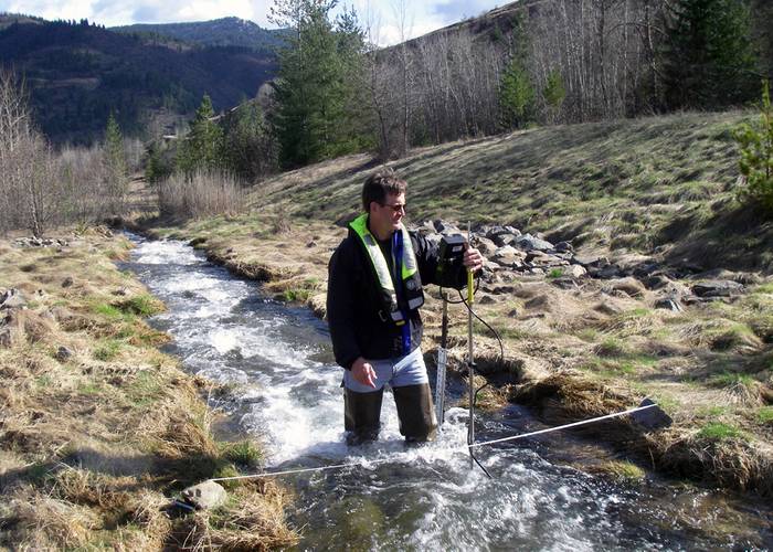 What:	Hydrologist Measuring Streamflow When:	4/11/2014 Where: 	Smelterville, ID, USA  Details:	USGS hydrologist Greg Clark measures streamflow on Government Gulch Creek, a tributarty to the Coeur d’Alene River in northern Idaho. Streamflow data collected are included in the Coeur d’Alene Basin Environmental Monitoring Program the USGS conducts in cooperation with the Environmental Protection Agency.  Credit: U.S. Geological Survey  Department of the Interior/USGS U.S. Geological Survey/photo: De
