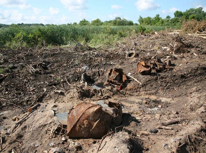 The White Lake Montague Dump site restoration was littered with rusty barrels, tires and other debris. (Photo: EPA)