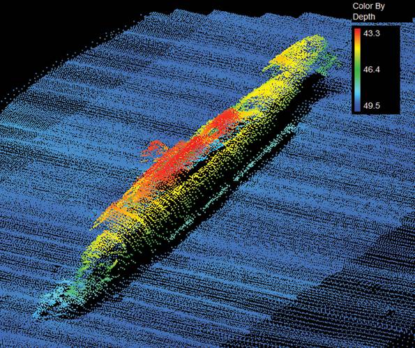 The wreck of U390 sunk on July 5, 1944 by HMS Tavy and HMS Wanderer using the hedgehog forward firing mortar. Only one member of the U-Boat survived. U-390 was a snorkel fitted type VIIC boat and was on her third war patrol at the time of her loss. In the image the bow is to the top with the propellers and rudders clearly visible at the stern. The conning tower can just be made out to the right as is the port side ballast tank (the bulge on the central hull). Whether the damage to this is a resu
