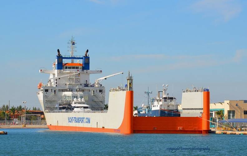 DYT Yacht Transport’s 686’ flagship Yacht Express is shown here in Port Everglades, Fla., before heading Down Under with its cargo of precious yachts, including the 126-foot research vessel M/V OCEARCH (blue hull). (photo credit Tom Serio Photography).