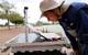 UTEP alumnus Fernando Sotelo prepares the autonomous boat for mapping Ascarate
Lake’s underwater terrain. Credit: The University of Texas at El Paso.