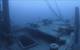 An anchor rests still attached on the bow of the sunken schooner barge Ironton, lost in a collision in 1894. Today the vessel sits upright and intact, all three masts still standing. Image Credit: NOAA Thunder Bay National Marine Sanctuary, Undersea Vehicles Program UNCW