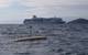 3.5m AutoNaut and Plymouth Ferry. AutoNaut can be controlled using local UHF or WiFi comms, or an Iridium Satellite link. 