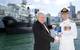 Commodore Peter Scott, CSC, RAN is handed a copy of the book "Century of Silent Service" from one of the authors, Mr Lloyd Blake. (Photo: Tom Gibson)