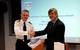 Commodore Guy Robinson from Navy Command Headquarters shaking hands with Geraint West, the NOC’s Director of National Marine Facilities after the signing of the Memorandum of Understanding
