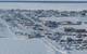 The community of Utqiagvik, Alaska, sits on Alaska’s Arctic Ocean coast. A narrow lead of open water is at the edge of the shore-fast sea ice. Photo by Andy Mahoney, UAF Geophysical Institute