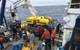 The team discusses dive operations on the Nautilus deck (Photo: ONC)