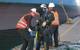 Divers getting ready for underwater operation.