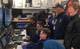 The expedition team hosted visitors to the mission control van to see ASV BEN mapping unfold in real time. (Photo: Ocean Exploration Trust)