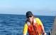 Figure 7.  The author, Kevin Hardy, lifts the single sphere hadal lander, DOV Mary Carol, with one hand onto the ship after a test dive off San Diego in 2002.  DOV Mary Carol later dove both the Puerto Rico Trench and Aleutian Trench.  (Photo by Dr. Art Yayanos, Scripps Institution of Oceanography/UCSD)